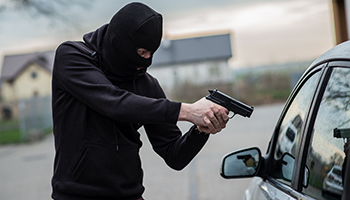 Man robbing a car