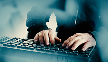 man typing on a keyboard